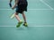 Indoor badminton court with the player legs