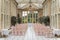 an indoor banquet area with tables and chairs and large windows