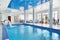 Indoor big blue swimming pool interior