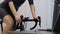 Indoor cycling. Fitness cardio workouts. Woman is training on cycling trainer
