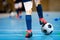 Indoor futsal soccer players playing futsal match. Indoor soccer sports hall