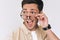 Indoor image of amazed excited young man doesn`t believe his success, keeps hands on eyeglasses, says omg or wow. Surprised male