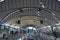 Indoor image of Sydney Olympic Park Railway Station with artistic rooftop and platform number sign