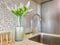 Indoor Oasis: a Refreshing Bathroom with Plants and Rustic Faucet