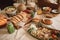 indoor picnic, with basket, plates, and sandwiches