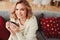 indoor portrait of young selfish beautiful woman enjoying winter time at home