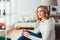 Indoor portrait of young selfish beautiful woman enjoying winter time at home