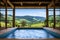 indoor spa pool in a cabin with view of hills