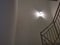 Indoor staircase light bulb at night