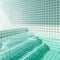 Indoor swimming pool with green tiles wall, floor and stairs, modern concept interior design. 3d rendering illustration