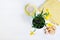 Indoor table setting. Narcissus flower in a pot with cookies and