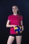 Indoor young volleyball woman player isolated on dark background