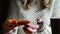 Indoors video of girl's hand holding a piece of pizza