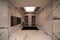 Indoors view of the elevator hall with marble wall in a modern building