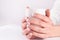 Indulge in Beauty and Comfort: Coffee Cup in Young Woman\\\'s Hands with French Nails Manicure