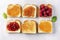 Indulge in the close-up view of a delicious breakfast spread. Toasts adorned with an assortment of flavorful jams, arranged