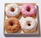 Indulge in a Rainbow of Flavors: Four Vibrant Doughnuts to Satisfy Your Sweet Tooth!