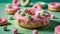 Indulge in the whimsical allure of a delectable pink donut adorned with a sprinkle of tiny green nuggets powder.