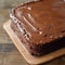 Indulgent chocolate cake topped with smooth, creamy ganache frosting