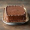 Indulgent chocolate cake topped with smooth, creamy ganache frosting