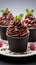 Indulgent chocolate cakes nestled in a cup, set against a pure white canvas