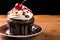 Indulgent chocolate cupcake, a sweet delight with a red cherry