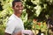 Indulging his green thumb. Portrait of a handsome young man gardening.