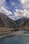 Indus Flow: Majestic Serenity of Ladakh\\\'s Barren Valley with Snowcapped Peaks and Tranquil Waters