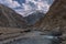 Indus Flow: Majestic Serenity of Ladakh\\\'s Barren Valley with Snowcapped Peaks and Tranquil Waters