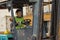 Industial background of african american container yard and cargo worker driving forklift a loading area