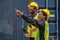 Industrail background of african american containers yard and cargo inspector team working at containers loading area