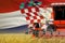 industrial 3D illustration of 3 red modern combine harvesters with Croatia flag on grain field - close view, farming concept