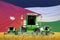 Industrial 3D illustration of 4 light green combine harvesters on wheat field with flag background, Jordan agriculture concept