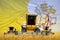 industrial 3D illustration of four orange combine harvesters on wheat field with flag background, Holy See agriculture concept