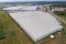 Industrial agricultural greenhouses for growing vegetables. Aerial view.