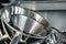 Industrial aluminum colanders on professional kitchen close up