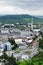 Industrial area. View of the city with factories, buildings and green hills. Pollution and air concept.