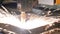 Industrial automatic CNC plasma cutting machine cuts steel sheet.