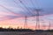 Industrial background group silhouette of transmission towers sunset