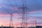 Industrial background group silhouette of transmission towers sunset