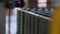 Industrial background with raw ceramic blocks being cut by saw string. Stock footage. Brick and block production