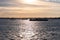 Industrial Boats and Barges in New York Harbor with the Shore of New Jersey during a Sunset