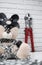 Industrial bolt cutter on the background of a Teddy bear dressed in bdsm accessories and chained