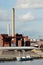 Industrial building and chimney and boat