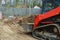 industrial building construction site mini bulldozer levelling and moving soil