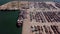 Industrial Cargo area with container ship in dock at port, Aerial view