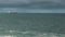 Industrial cargo ship in the open Atlantic ocean - time lapse.