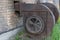 Industrial centrifugal radial exhaust fans of snail type with traces of rust, installed near building made of white bricks