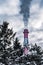 Industrial chimneys with dramatic smoke in nature on cold winter day