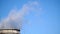 Industrial chimneys emits toxic pollutants into the sky polluting the environment